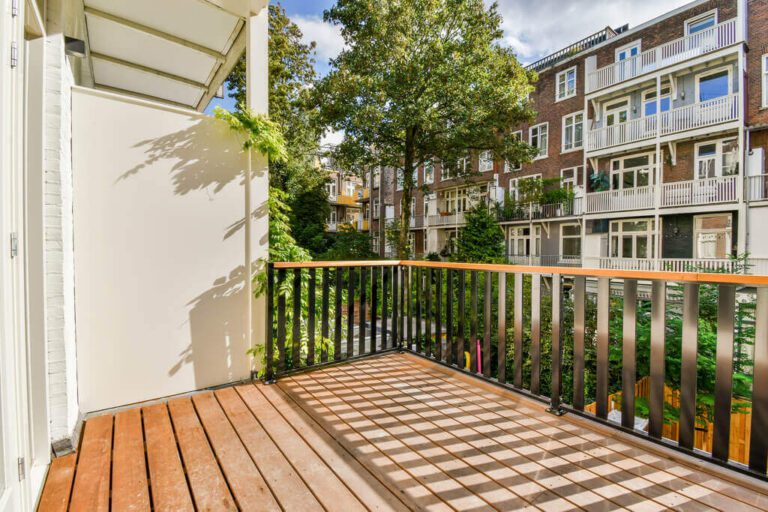 Residential apartment balcony with overhead structure requiring sprinklers under NFPA 13R Section 6.6.5.1